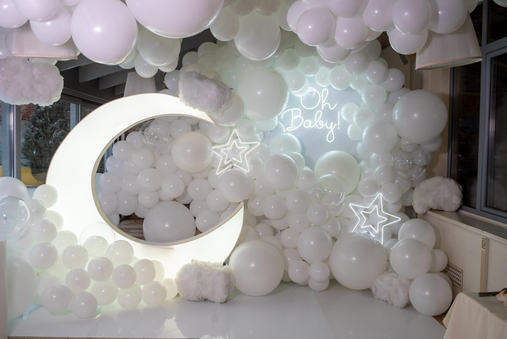 Celebrate the arrival of a little one with a whimsical baby shower! Balloons and a crescent moon add a touch of magic to the Lunar Love theme.
