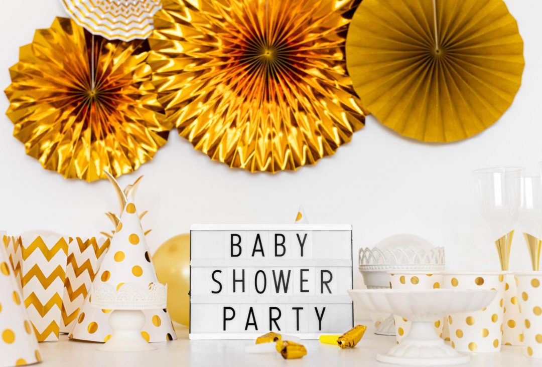 Get ready to celebrate in style with stunning gold and white baby shower decorations, creating an unforgettable accent wall in Qatar