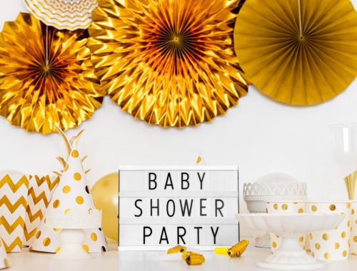 Get ready to celebrate in style with stunning gold and white baby shower decorations, creating an unforgettable accent wall in Qatar