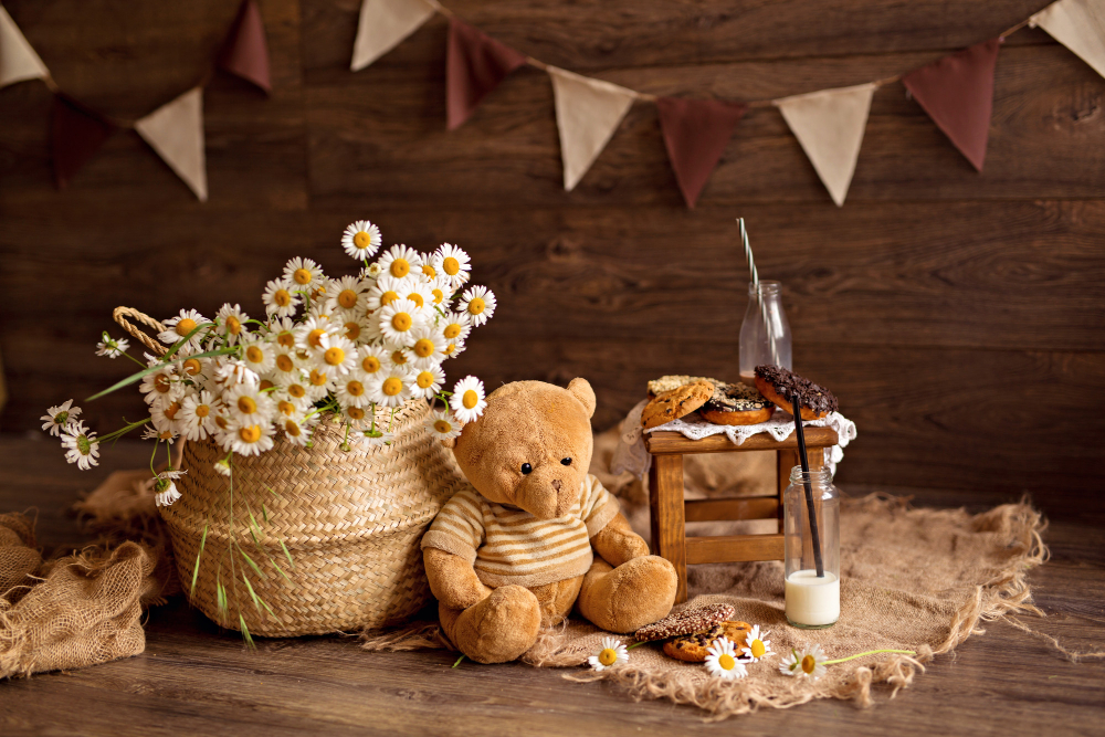 A cuddly teddy bear happily lounges beside a charming basket of vibrant flowers, adding a touch of whimsy to Teddy Bear Bliss Baby Shower Ideas.