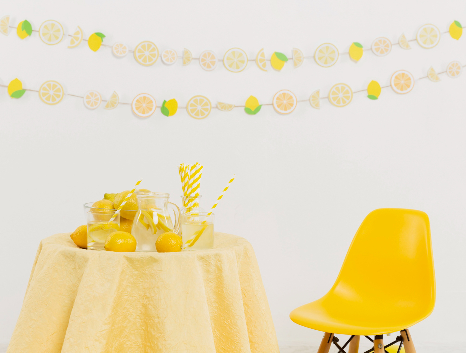 A vibrant yellow tablecloth sets the stage for a joyous celebration at the Fruitful Celebration Baby Shower Ideas.