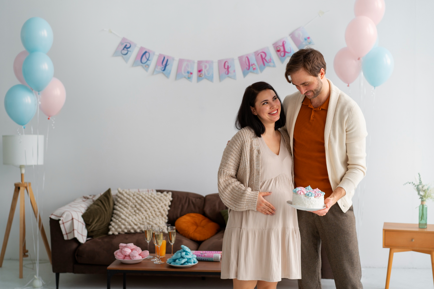 A couple beaming with joy as they proudly stand before a magnificent cake, celebrating a Royal Prince or Princess Baby Shower