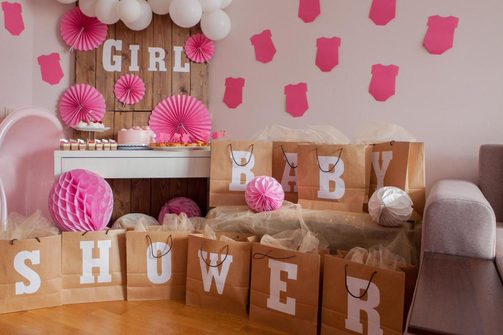 Pink balloons and paper bags adorn an elegant baby shower, creating a whimsical atmosphere for celebrating the arrival of a precious little one